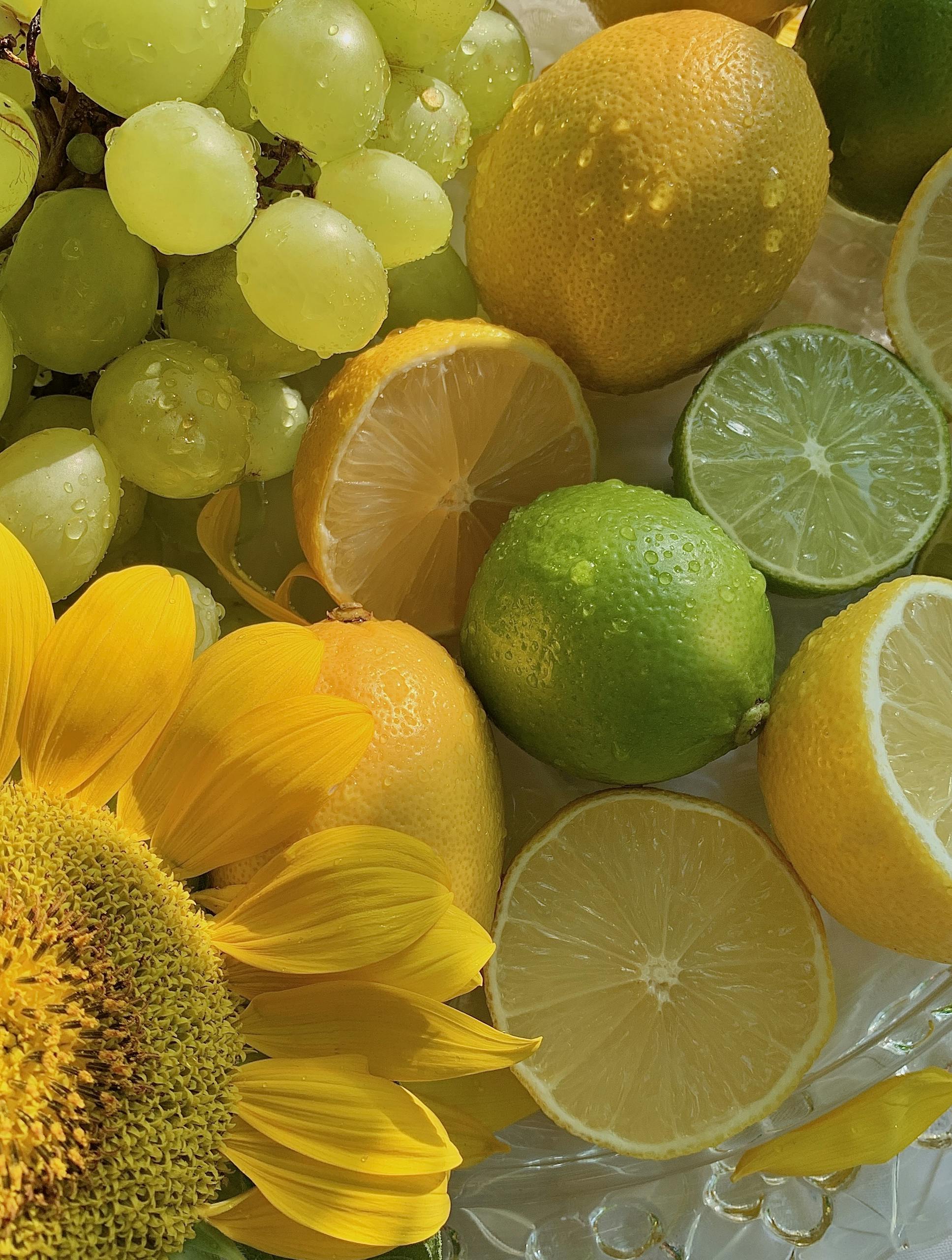 Fresh citrus fruits and sunflower create a vibrant and healthy composition.
